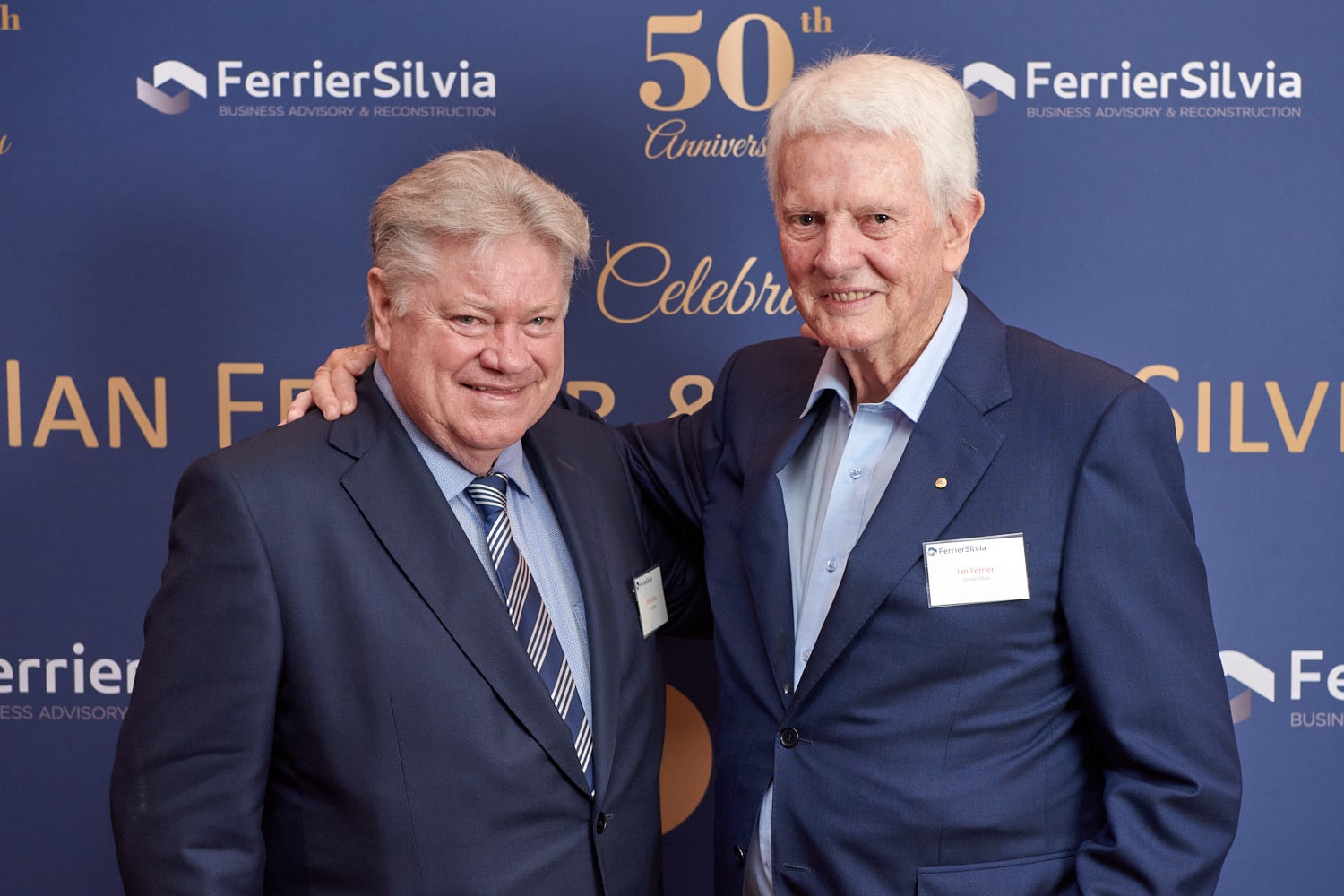 Two business men posing for 50th Business Anniversary Event photo