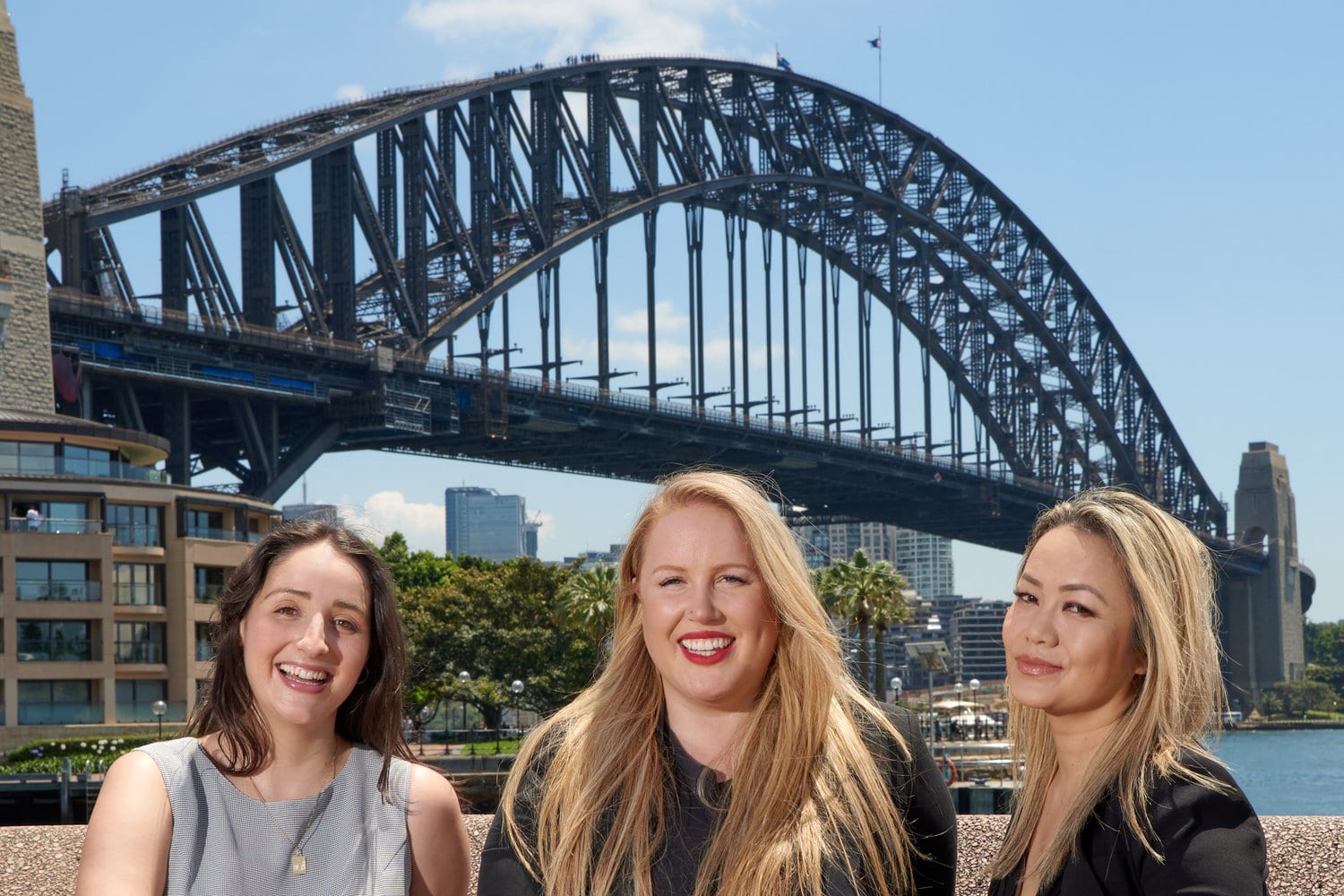 Photo of 3 people with Sydney Harbour Bridge Backdrop from 4 Circular Quay W The Rocks NSW 2000.